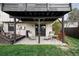 Covered patio area with outdoor seating and backyard access at 6389 S Monaco Ct, Centennial, CO 80111