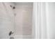 Elegant shower with marble tiles and a clear glass door, offering a luxurious bathing experience at 6389 S Monaco Ct, Centennial, CO 80111