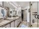 Modern bathroom boasts a double vanity, walk-in closet, and stylish wood-look flooring at 4205 E 106Th Pl, Thornton, CO 80233