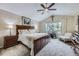 Spacious bedroom with a large window, vaulted ceiling, ceiling fan, and comfortable furnishings at 4205 E 106Th Pl, Thornton, CO 80233