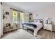 Cozy bedroom featuring a bed, nightstand, and window with natural light at 4205 E 106Th Pl, Thornton, CO 80233