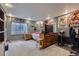 Finished basement bedroom featuring a window, dresser, and desk space at 4205 E 106Th Pl, Thornton, CO 80233