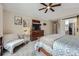 Comfortable bedroom with neutral tones, a ceiling fan, and ample natural light at 4205 E 106Th Pl, Thornton, CO 80233