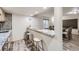 Eat-in breakfast bar with stools, granite countertop, and pendant lighting; perfect for casual dining at 4205 E 106Th Pl, Thornton, CO 80233