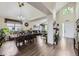 Open dining room featuring a chandelier, plants and hardwood floors at 4205 E 106Th Pl, Thornton, CO 80233