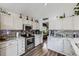 Well-equipped kitchen with stainless steel appliances, granite countertops, and hardwood floors at 4205 E 106Th Pl, Thornton, CO 80233