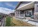 Beautiful backyard with a covered patio, manicured lawn, and fenced border at 8463 S Quemoy Ct, Aurora, CO 80016