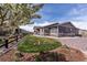 Well-manicured backyard with lush lawn and charming landscaping, providing a serene outdoor space at 8463 S Quemoy Ct, Aurora, CO 80016