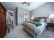 Comfortable bedroom with carpet, neutral color scheme, and side tables with reading lamps at 8463 S Quemoy Ct, Aurora, CO 80016