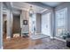Elegant foyer with hardwood floors, coffered ceilings, and seamless transition to the staircase and other living spaces at 8463 S Quemoy Ct, Aurora, CO 80016