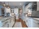 Well-appointed kitchen showcasing a center island, sleek cabinetry, stainless steel appliances, and granite counters at 8463 S Quemoy Ct, Aurora, CO 80016