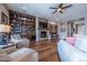 Comfortable living room showcasing a fireplace, built-in shelving, and stylish decor, creating an inviting atmosphere at 8463 S Quemoy Ct, Aurora, CO 80016