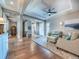Spacious living room showcasing hardwood floors and elegant columns, creating a grand entrance at 8463 S Quemoy Ct, Aurora, CO 80016