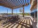 Community outdoor kitchen with a grill and dining area, perfect for neighborhood gatherings at 8463 S Quemoy Ct, Aurora, CO 80016