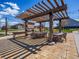 Community outdoor kitchen with shaded seating, offering a great space for socializing with neighbors at 8463 S Quemoy Ct, Aurora, CO 80016