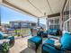 Inviting covered patio featuring comfortable outdoor seating, ideal for relaxing and entertaining with neighborhood views at 8463 S Quemoy Ct, Aurora, CO 80016