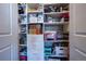 Organized storage closet with shelving and drawers, maximizing space and functionality at 8463 S Quemoy Ct, Aurora, CO 80016