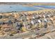 Aerial view of a neighborhood near a lake, showcasing the community setting and location at 853 Mockingbird St, Brighton, CO 80601