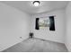 Bright bedroom with a black curtain at 853 Mockingbird St, Brighton, CO 80601