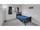 Bedroom featuring carpet and a single window at 853 Mockingbird St, Brighton, CO 80601