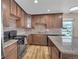 Beautiful updated kitchen with granite countertops, stainless steel appliances, and stylish tile backsplash at 853 Mockingbird St, Brighton, CO 80601