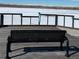 Bench seating on a lakeside pier with a view of frozen lake and distant mountains at 853 Mockingbird St, Brighton, CO 80601