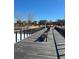 Park bridge with benches providing a scenic spot in the neighborhood at 853 Mockingbird St, Brighton, CO 80601