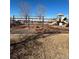 Community playground featuring slides and swings near a frozen lake, great for Gathering fun at 853 Mockingbird St, Brighton, CO 80601