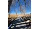 Scenic view of a concrete path leading to a lake through a neighborhood at 853 Mockingbird St, Brighton, CO 80601