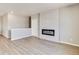 Finished basement with fireplace and neutral color scheme at 18359 Field Mint Pt, Parker, CO 80134