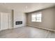 Finished basement with fireplace and neutral color scheme at 18359 Field Mint Pt, Parker, CO 80134