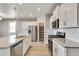 Modern kitchen with white cabinets and granite countertops at 18359 Field Mint Pt, Parker, CO 80134