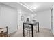 Basement with table featuring seating, neutral carpet and white walls at 3820 S Grant St, Englewood, CO 80113