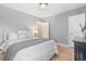 Comfortable bedroom featuring a bed, dresser, and hardwood floors at 3820 S Grant St, Englewood, CO 80113