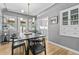 Dining room featuring modern lighting, a built in cabinet and view of the eat-in kitchen at 3820 S Grant St, Englewood, CO 80113
