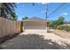 Detached garage with a concrete driveway, providing ample parking and storage space at 3820 S Grant St, Englewood, CO 80113