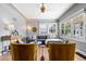 Bright living room with large windows, hardwood floors, and stylish furnishings at 3820 S Grant St, Englewood, CO 80113