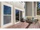 Balcony with sliding glass door entry and comfy seating, perfect for relaxing outdoors at 909 Reynolds Farm Ln # C2, Longmont, CO 80503