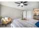 Bedroom with ceiling fan, adjacent bathroom, and closet at 909 Reynolds Farm Ln # C2, Longmont, CO 80503