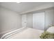 Bedroom with an open layout, closet, soft lighting, and soothing gray tones offers a serene space at 909 Reynolds Farm Ln # C2, Longmont, CO 80503