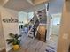 Bright entryway featuring a modern staircase and wood laminate flooring at 909 Reynolds Farm Ln # C2, Longmont, CO 80503