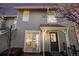 Two story home boasts a front door and sliding glass doors that allow natural light to flood the kitchen at 909 Reynolds Farm Ln # C2, Longmont, CO 80503