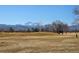 Scenic golf course view with mountains in the background on a sunny day at 909 Reynolds Farm Ln # C2, Longmont, CO 80503