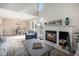 Comfortable living room with a fireplace, and a view of the dining area and outside balcony at 909 Reynolds Farm Ln # C2, Longmont, CO 80503