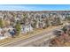 Scenic neighborhood featuring well-maintained townhomes and mature trees lining a quiet residential street at 909 Reynolds Farm Ln # C2, Longmont, CO 80503