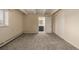 Bedroom with neutral walls, carpet flooring, and en-suite bathroom access at 1180 Yosemite St # 104, Denver, CO 80220