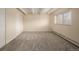 Bright bedroom with neutral walls, carpet flooring, and double closets at 1180 Yosemite St # 104, Denver, CO 80220