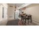 View of kitchen from dining area featuring wood table and chairs and carpeted floors at 1180 Yosemite St # 104, Denver, CO 80220
