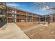 Exterior view of the building and its surrounding courtyard at 1180 Yosemite St # 104, Denver, CO 80220