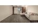 Living room with sectional sofa and access to a private patio at 1180 Yosemite St # 104, Denver, CO 80220